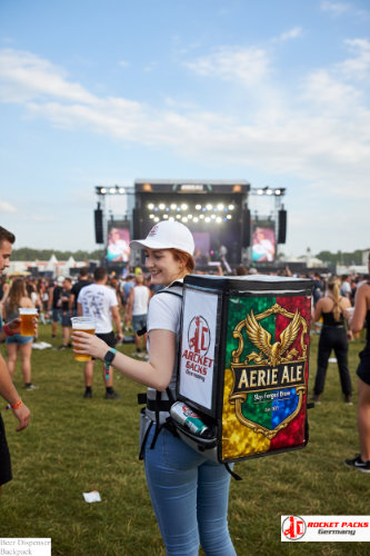 Backpack beer dispenser supporting mobile POS communication at Cambridge University event.