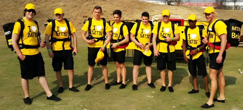 Beer hawker backpack serving festival visitors during Edinburgh Hogmanay New Year celebration.